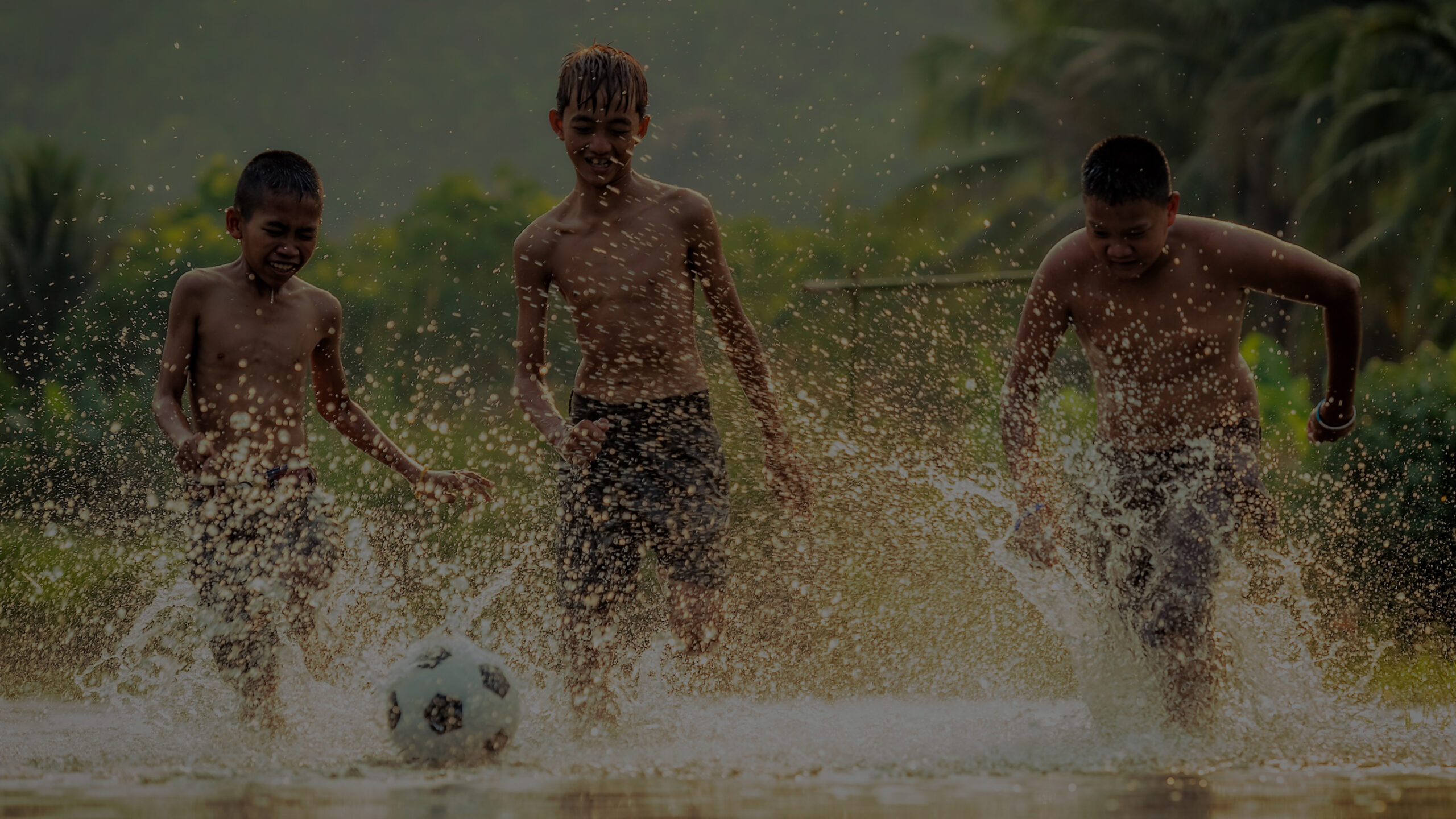 Kids running football